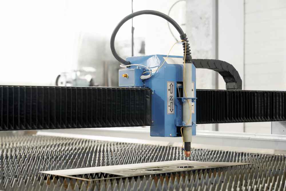 Accelerated corrosion testing to optimize laser marking in industrial materials Industrial laser marking machine engraving a metal plate, used for component identification and traceability in manufacturing processes.