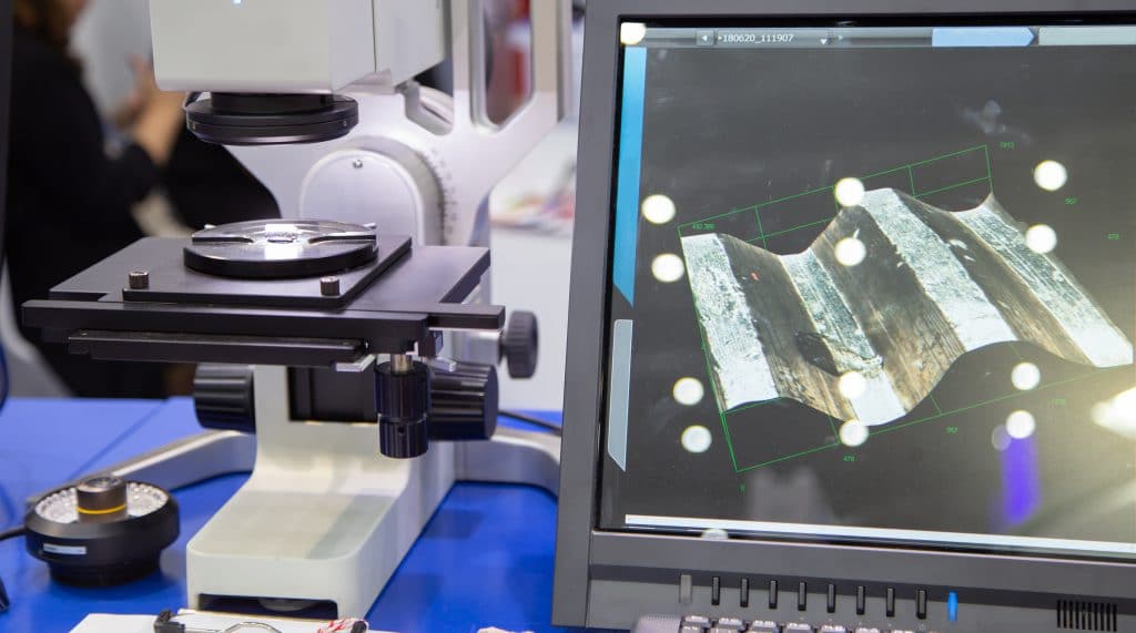 How to replicate a component when no technical drawings exist Microscope analyzing the surface of a material to characterize a part before replicating a component