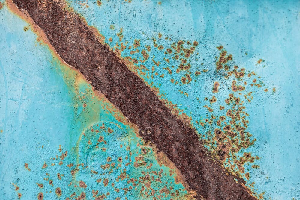 Corrosion test to evaluate the compatibility of a liquid product with copper components Corrosion crack on metal surface with degraded protective coating