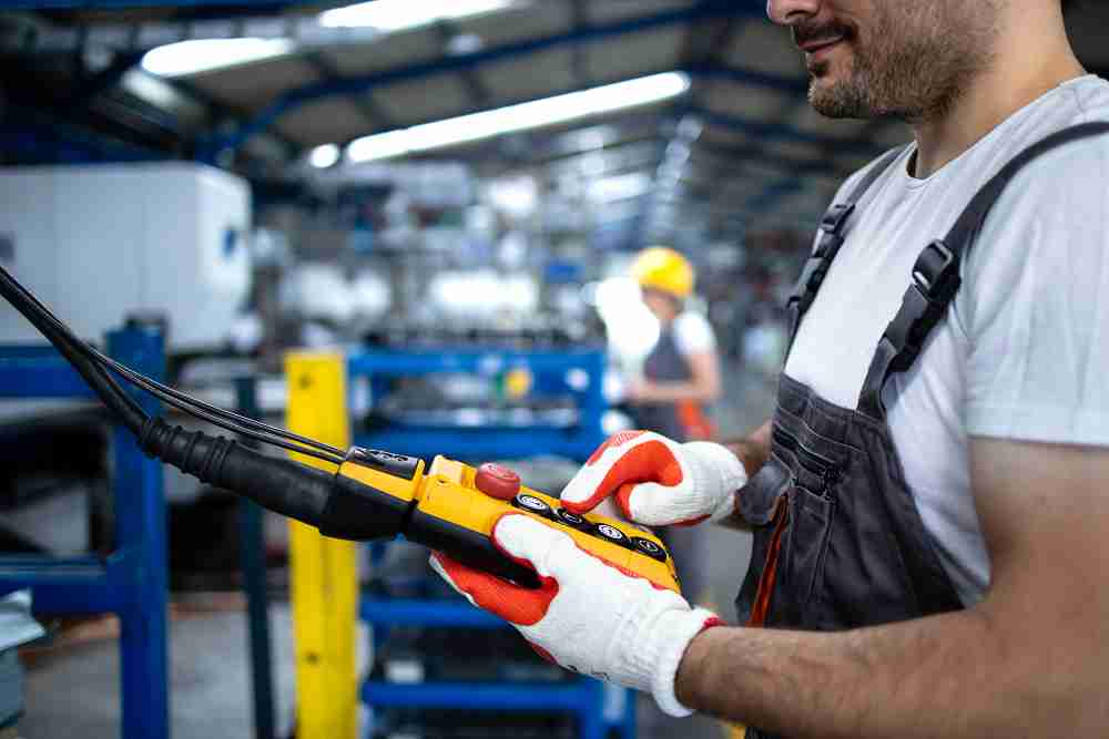 Operator inspecting production line to detect repetitive failure in industrial process