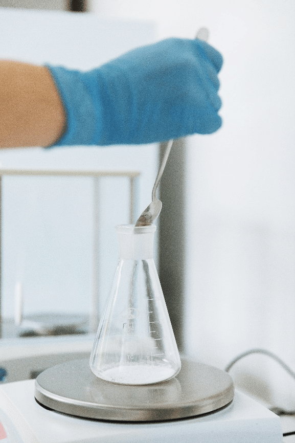 Industrial waste control to optimize the decontamination strategy Technician performing chemical characterization of industrial waste in laboratory to define a decontamination strategy