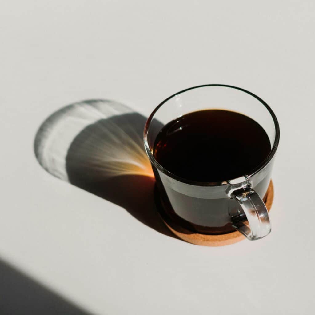 Glass failure analysis to prevent thermal shock breakage Glass cup with hot liquid illustrating potential thermal shock conditions in glass