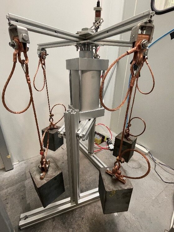 Custom test design to evaluate the elongation of electrical conductors with mechanical precision Custom setup for elongation testing of electrical conductors.